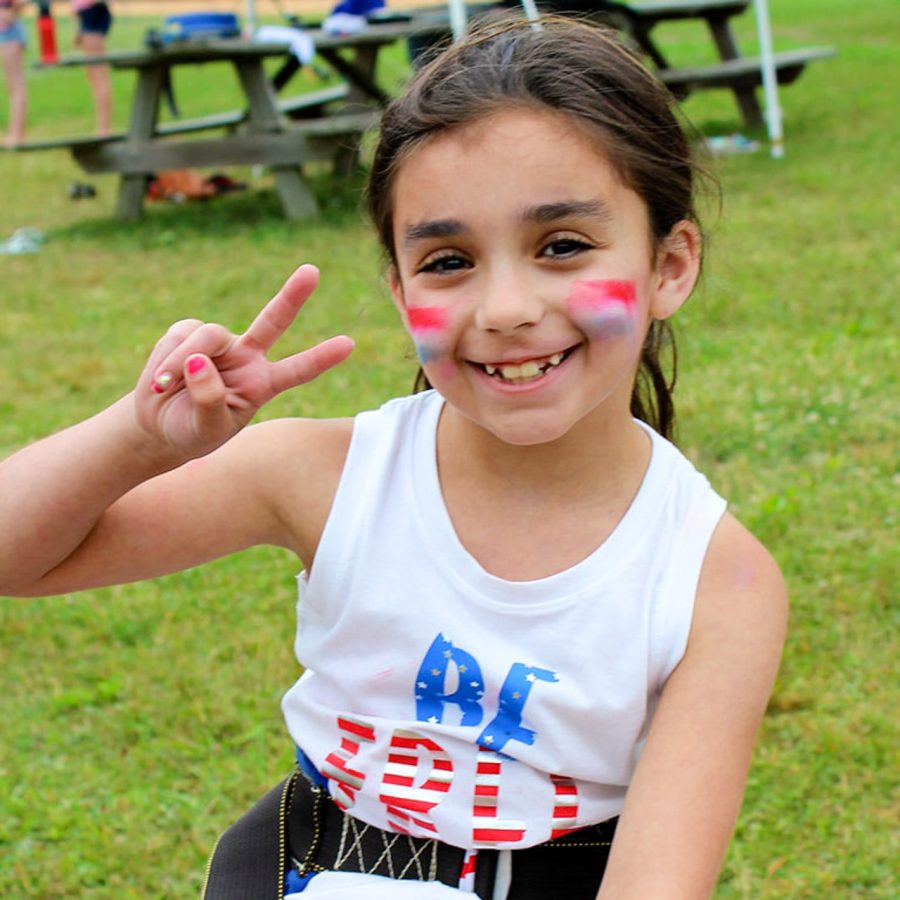 young girl camper with facepaint